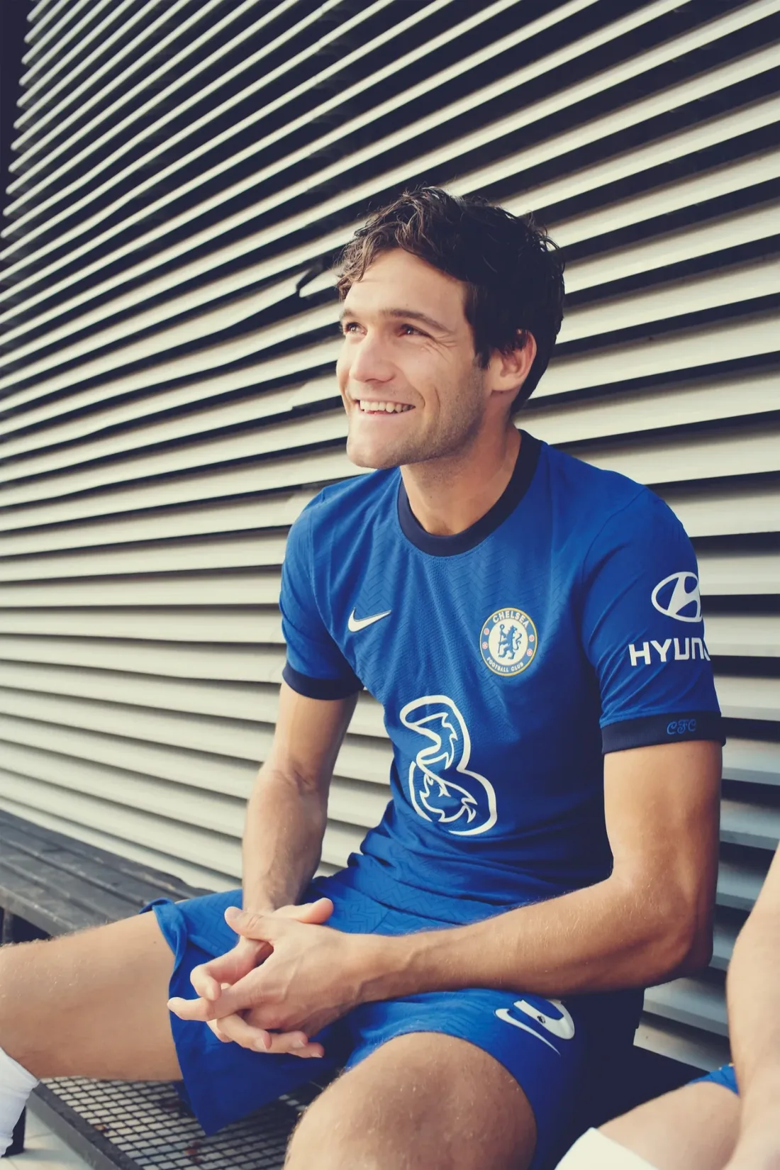 Chelsea FC: a player smiling on the bench